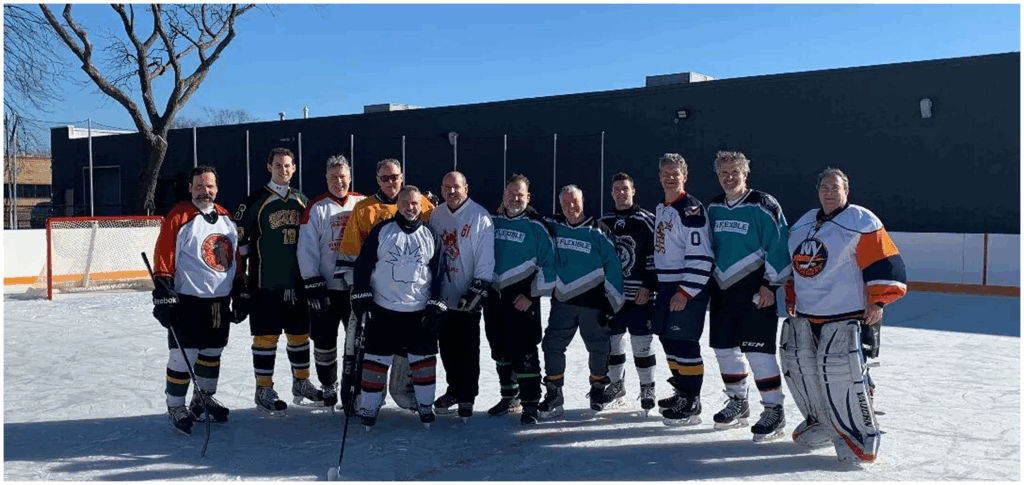 A team outside on the rink before the roof went up